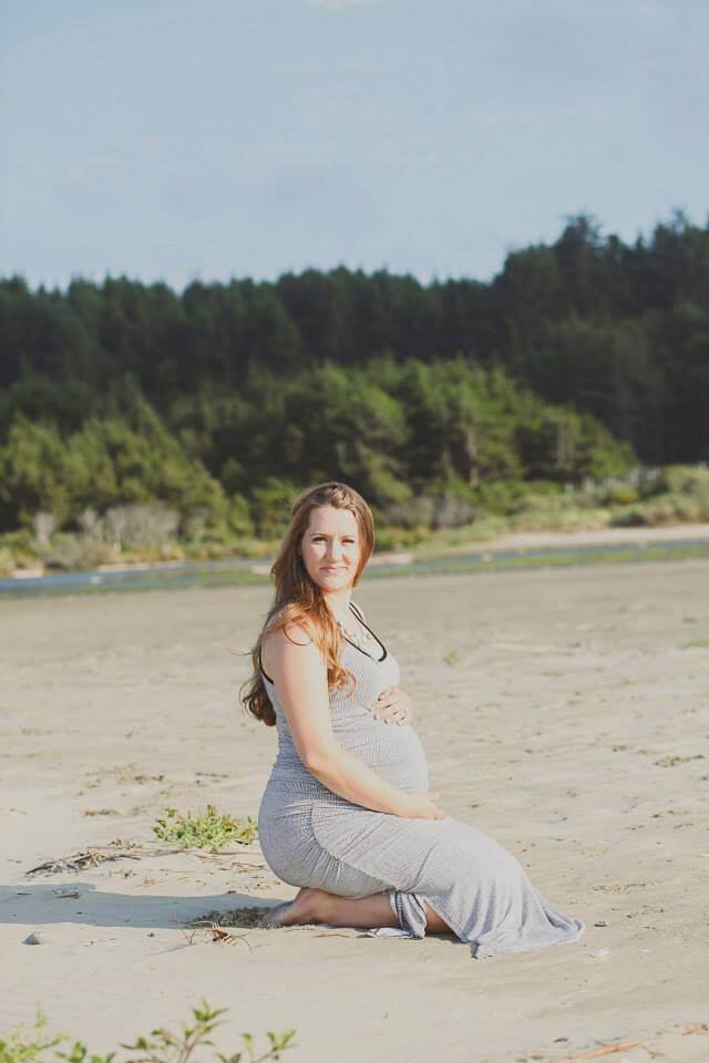 maternity photo shoot at the beach sitting on feet maternity photo shoot at the beach sitting on feet