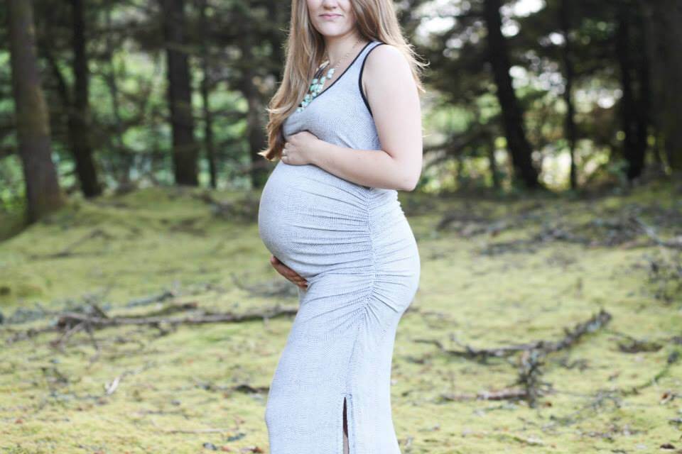 maternity photo shoot at the beach close up of a big belly maternity photo shoot at the beach close up of a big belly