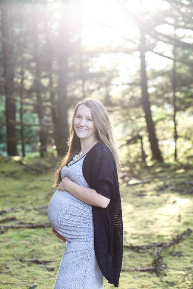 maternity photo shoot at the beach smiling holding pregnant belly maternity photo shoot at the beach smiling holding pregnant belly