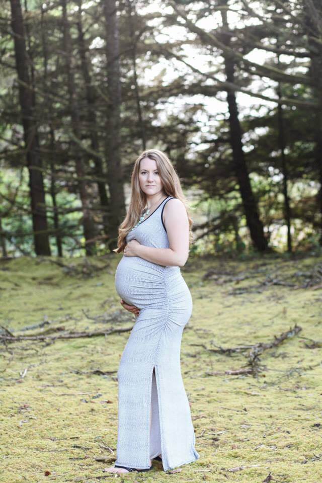 maternity photo shoot at the beach holding belly serious face maternity photo shoot at the beach holding belly serious face