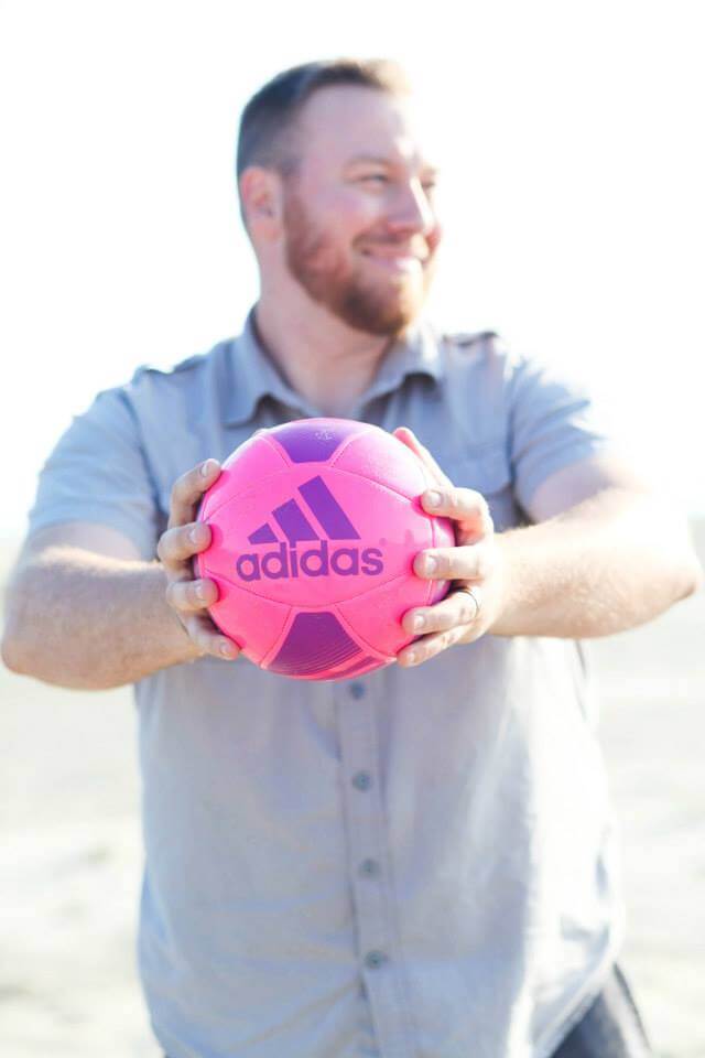 maternity photo shoot at the beach dad holding ball maternity photo shoot at the beach dad holding ball