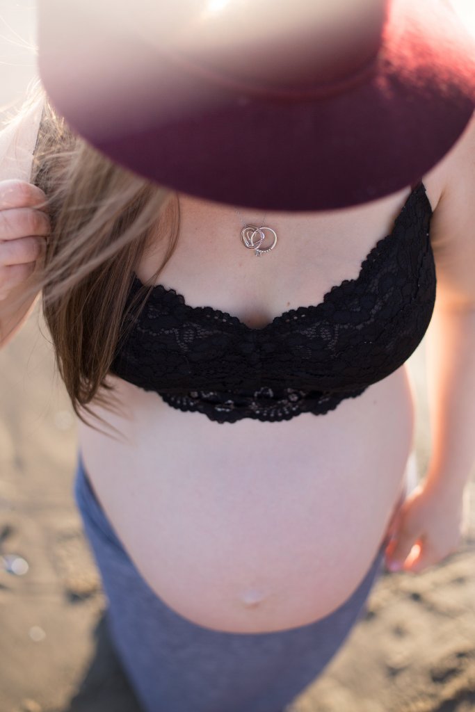 maternity photo shoot at the beach overhead shot of belly maternity photo shoot at the beach overhead shot of belly