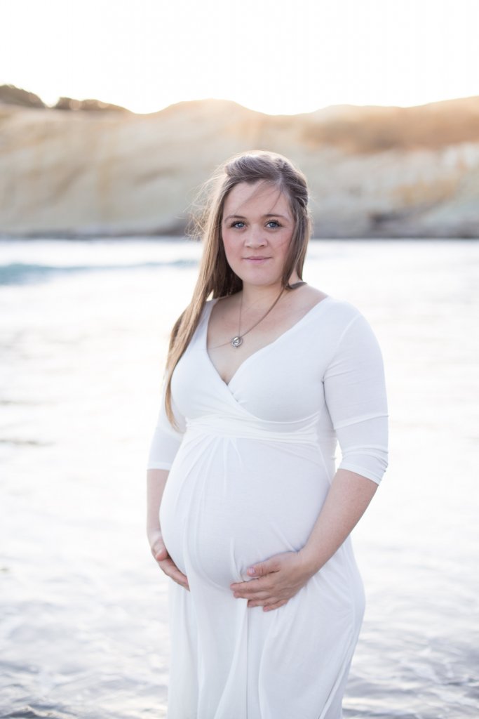 maternity photo shoot at the beach wearing white maternity photo shoot at the beach wearing white